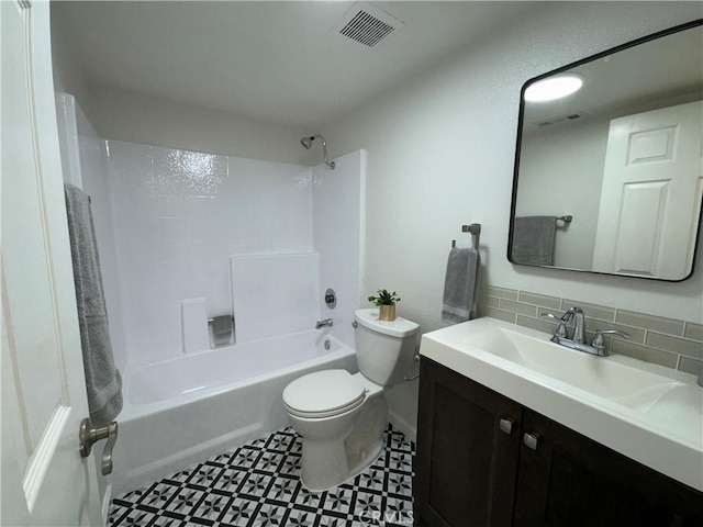 full bath featuring tasteful backsplash, vanity, toilet, visible vents, and bathing tub / shower combination