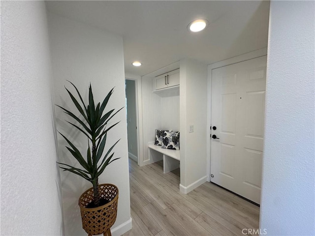 interior space with recessed lighting, light wood-style floors, and baseboards