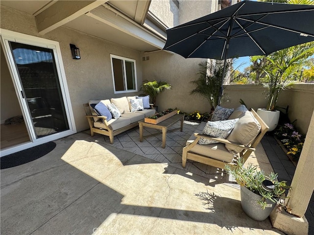 view of patio / terrace with fence and an outdoor living space