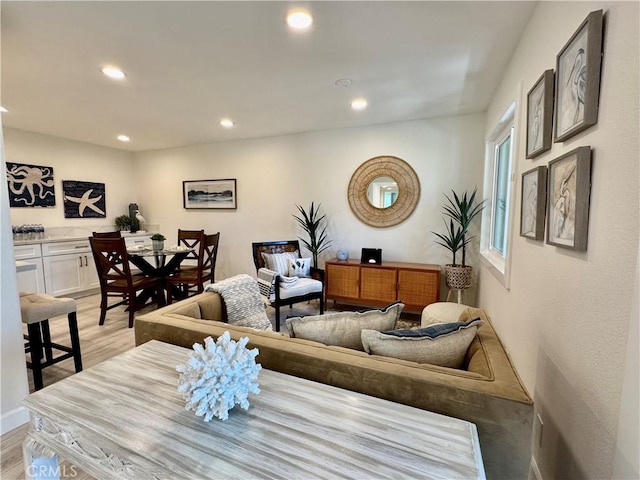 living area with recessed lighting and light wood-type flooring