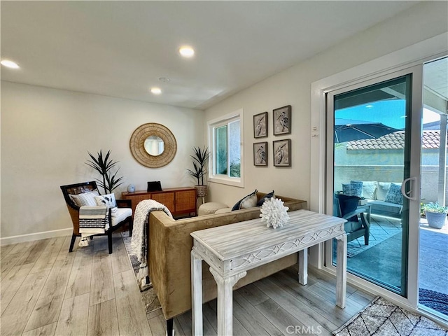 interior space with recessed lighting, light wood-style floors, and baseboards
