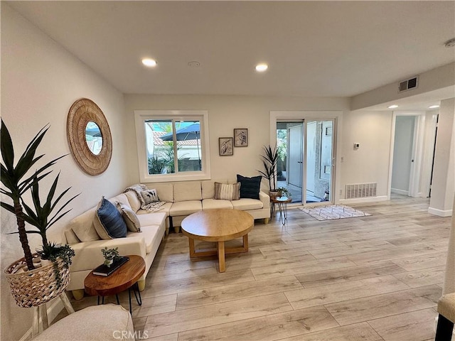 28181 Sorrento Unit 97, Laguna Niguel, CA 92677 - living room featuring light wood finished floors, recessed lighting, healthy amount of natural light, and baseboards