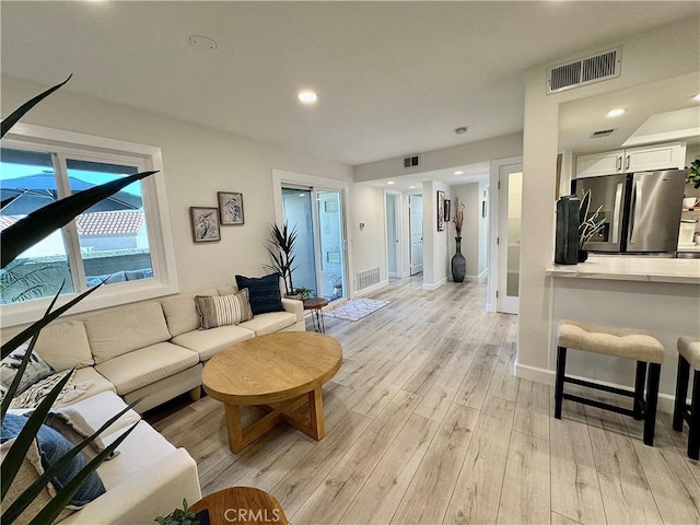 28181 Sorrento Unit 97, Laguna Niguel, CA 92677 - living area featuring light wood-style flooring, recessed lighting, and baseboards