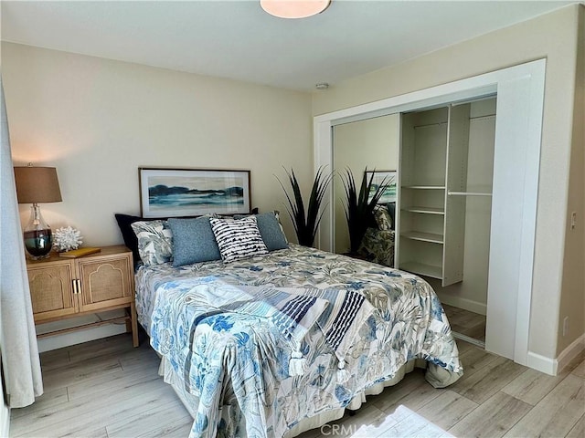 28181 Sorrento Unit 97, Laguna Niguel, CA 92677 - bedroom featuring wood finished floors, a closet, and baseboards