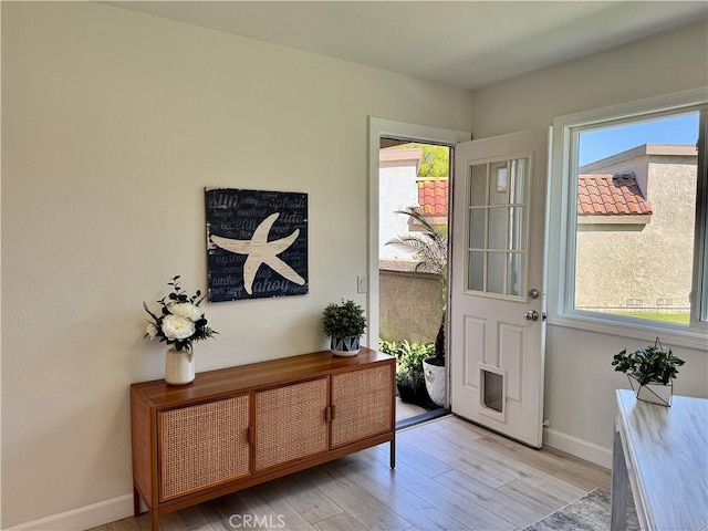 28181 Sorrento Unit 97, Laguna Niguel, CA 92677 - entrance foyer featuring light wood finished floors, plenty of natural light, and baseboards