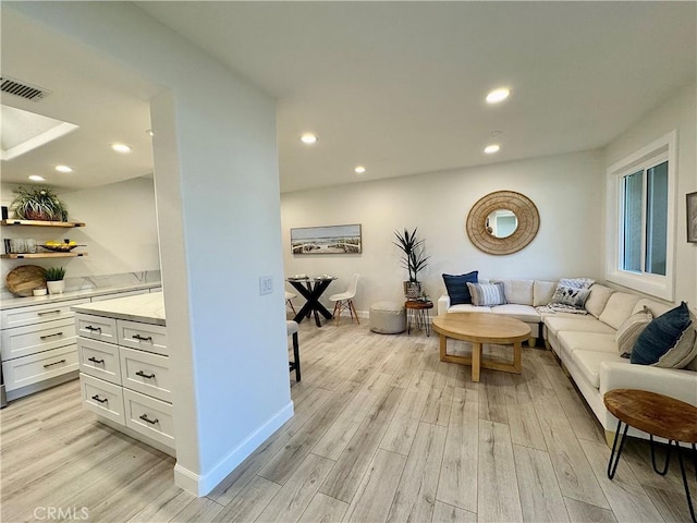 28181 Sorrento Unit 97, Laguna Niguel, CA 92677 - living room with light wood finished floors, recessed lighting, and baseboards