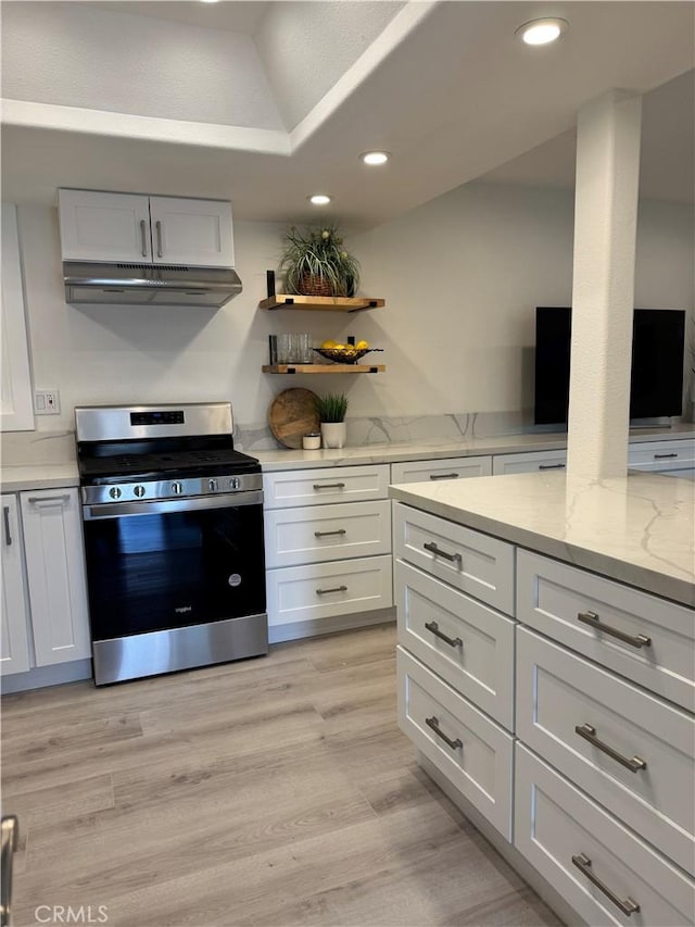 28181 Sorrento Unit 97, Laguna Niguel, CA 92677 - kitchen with stainless steel gas stove, under cabinet range hood, recessed lighting, white cabinets, and light stone countertops