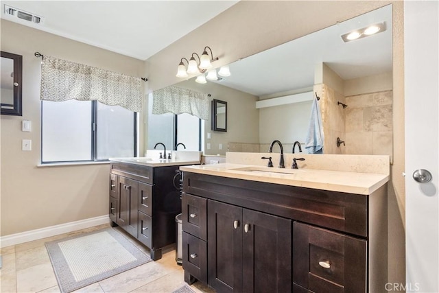 full bathroom featuring a sink, two vanities, baseboards, and visible vents