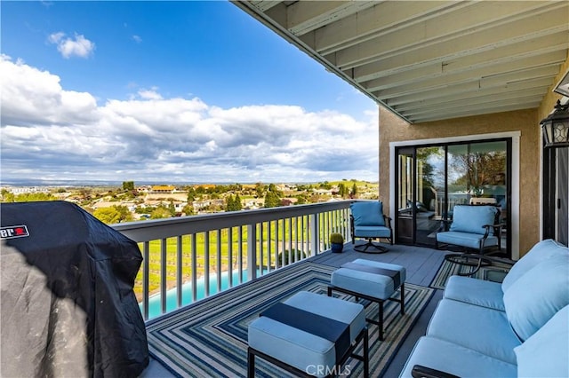 balcony with an outdoor living space and a grill