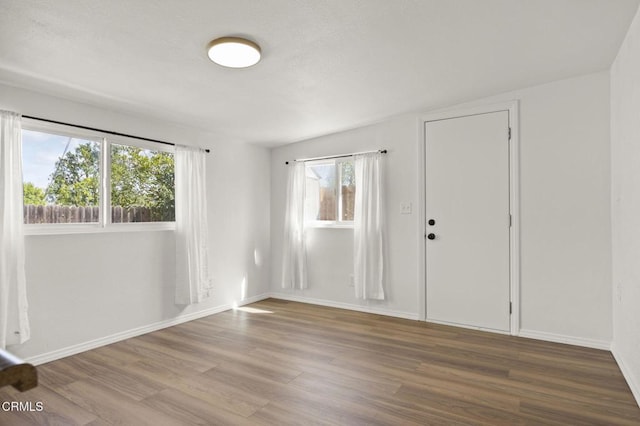 1414 Meadowbrook Rd, Ojai, CA 93023 - entrance foyer featuring wood finished floors, plenty of natural light, and baseboards