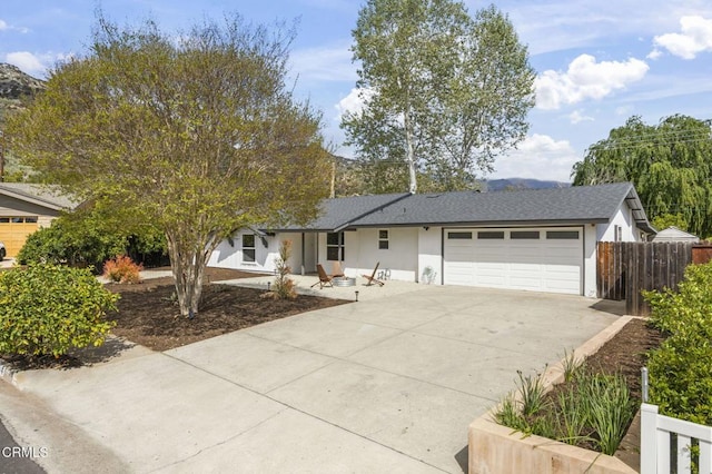 1414 Meadowbrook Rd, Ojai, CA 93023 - view of front of home featuring a garage, concrete driveway, fence, and stucco siding