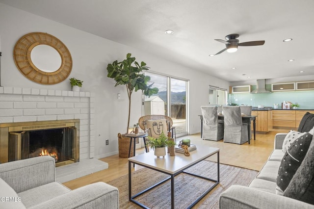 1414 Meadowbrook Rd, Ojai, CA 93023 - living room with light wood-style flooring, a fireplace, a ceiling fan, and recessed lighting