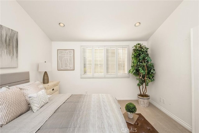 carpeted bedroom featuring baseboards, lofted ceiling, and recessed lighting