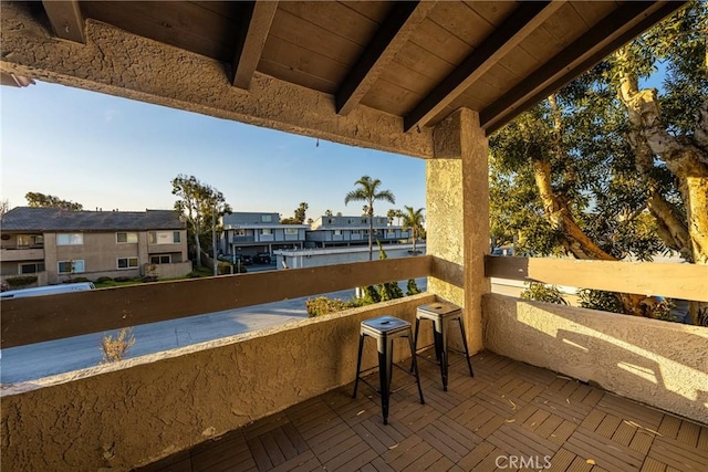 view of patio / terrace with a balcony and a residential view