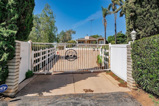 view of gate featuring fence