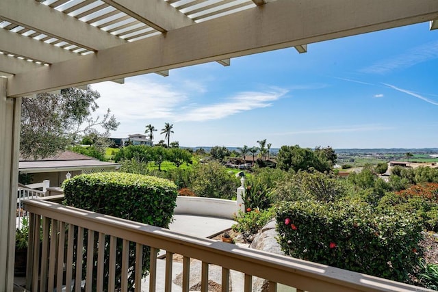 balcony featuring a pergola