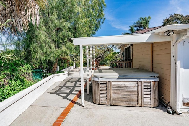 view of patio featuring a hot tub