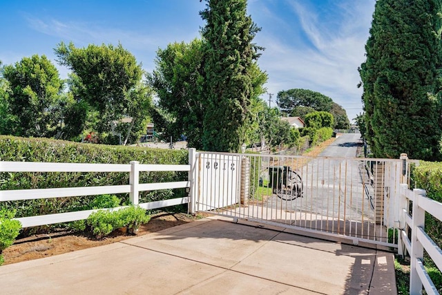 view of gate featuring fence
