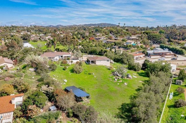 birds eye view of property with a residential view and a mountain view