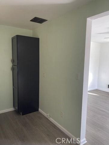 410 N San Jacinto St, Hemet, CA 92543 - empty room with wood finished floors, baseboards, and visible vents