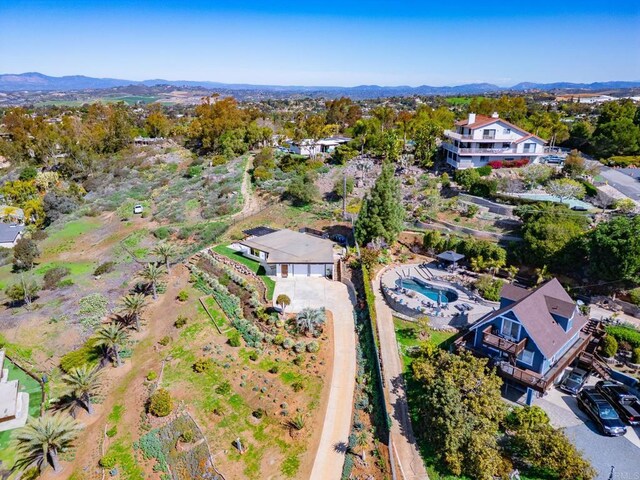 drone / aerial view featuring a mountain view