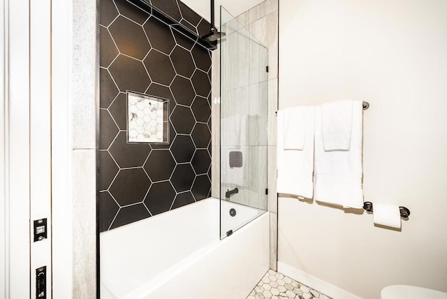 full bath featuring baseboards and bathing tub / shower combination