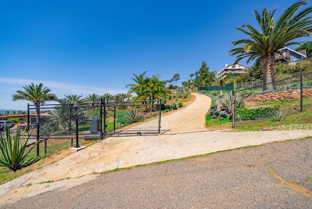 surrounding community with a gate and fence