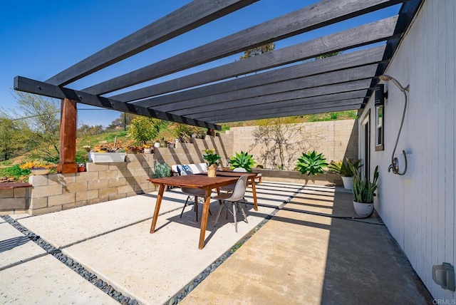 view of patio with outdoor dining area and a pergola