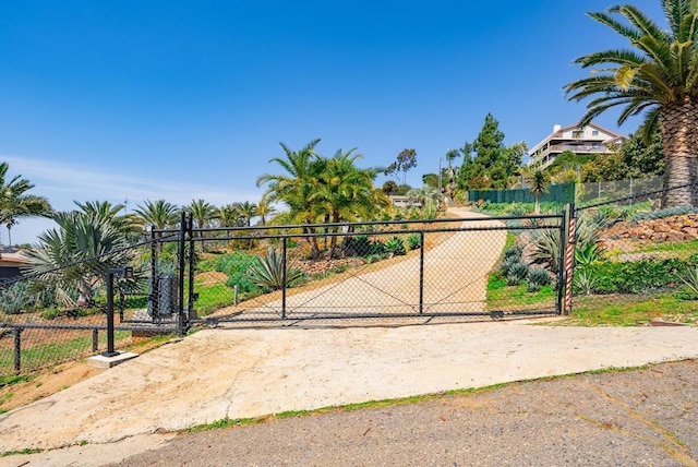 view of gate featuring fence