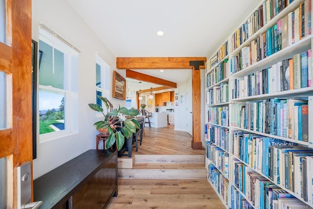 hall featuring recessed lighting, beamed ceiling, and wood finished floors