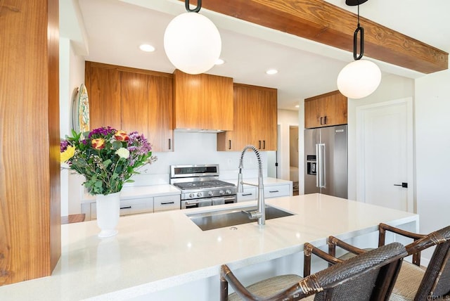 kitchen featuring a breakfast bar area, brown cabinetry, light countertops, and premium appliances