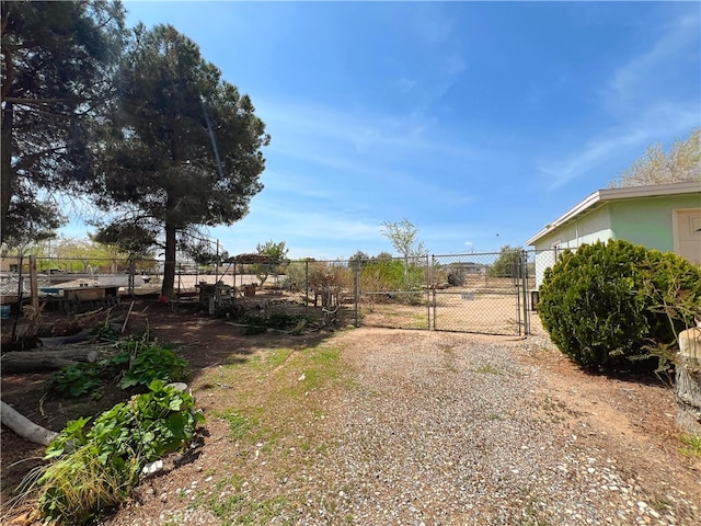 view of yard with fence and a gate