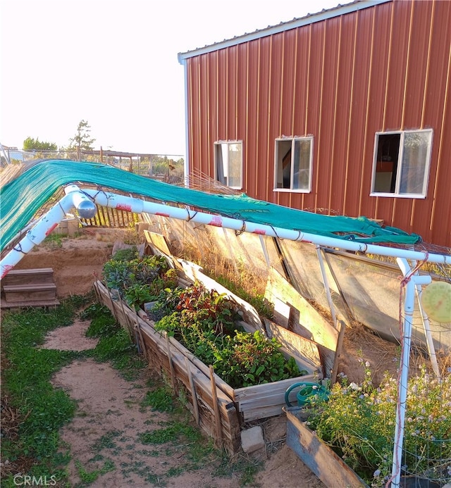 exterior space featuring a garden