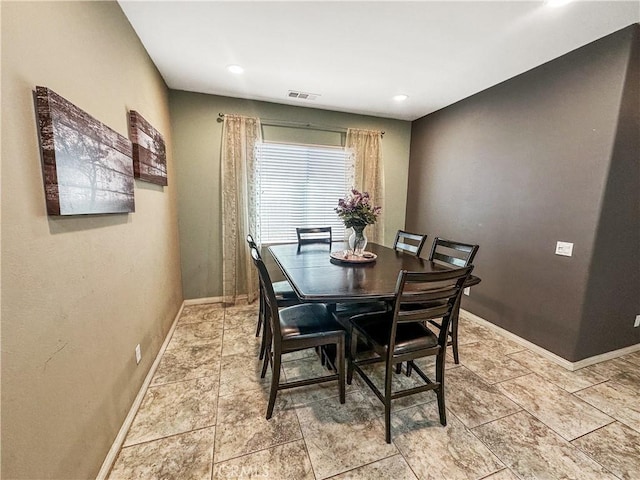 dining area featuring baseboards and visible vents