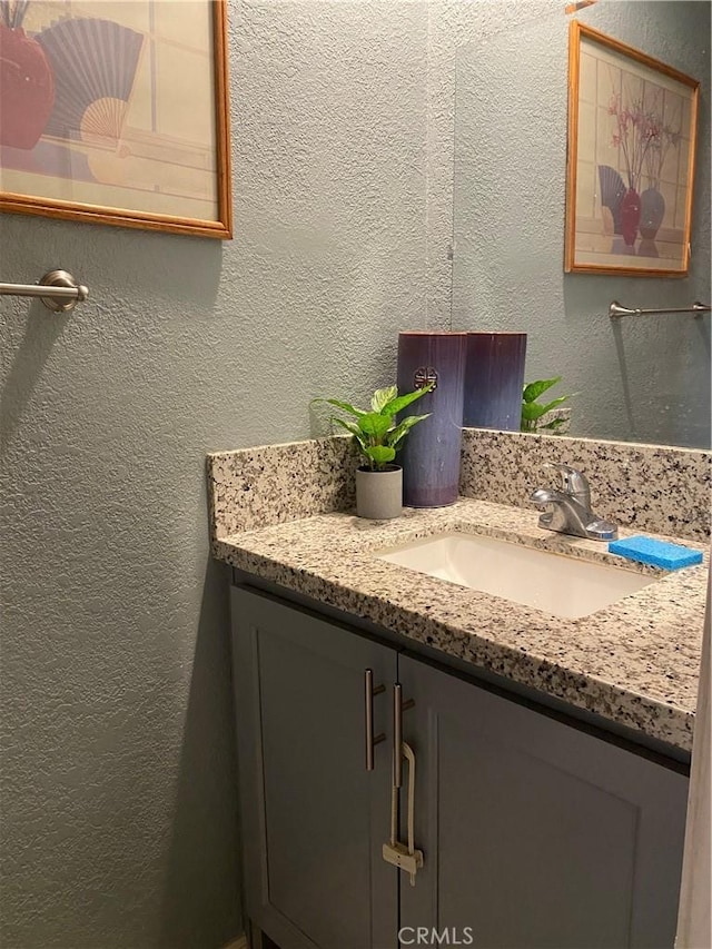 698 W Phillips Blvd, Pomona, CA 91766 - bathroom with a textured wall and vanity