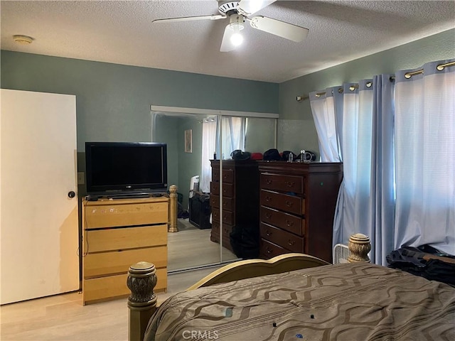 698 W Phillips Blvd, Pomona, CA 91766 - bedroom with light wood-type flooring, a ceiling fan, and a textured ceiling