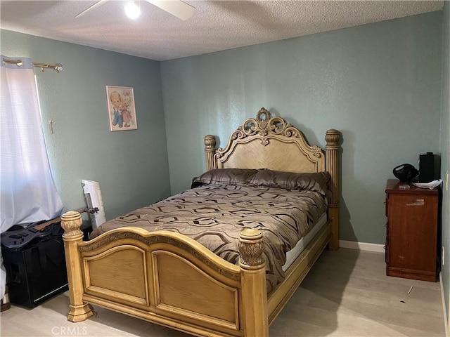 698 W Phillips Blvd, Pomona, CA 91766 - bedroom featuring light wood-style flooring, ceiling fan, and a textured ceiling