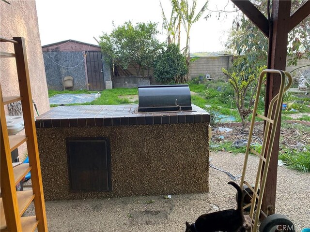 698 W Phillips Blvd, Pomona, CA 91766 - view of patio featuring area for grilling and fence
