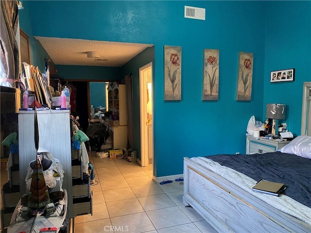 698 W Phillips Blvd, Pomona, CA 91766 - bedroom with a textured ceiling, visible vents, and light tile patterned floors