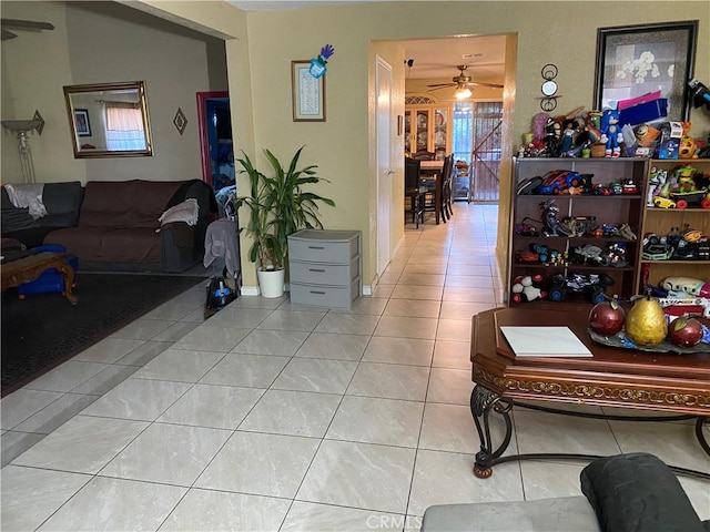 698 W Phillips Blvd, Pomona, CA 91766 - living area with tile patterned flooring and a ceiling fan