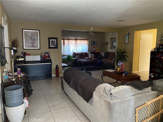 698 W Phillips Blvd, Pomona, CA 91766 - living area with a textured ceiling, visible vents, a ceiling fan, and light tile patterned floors