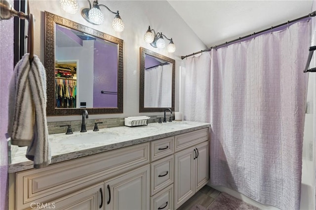 3140 Timberline Dr, Corona, CA 92882 - full bathroom with double vanity, a sink, tile patterned flooring, and lofted ceiling