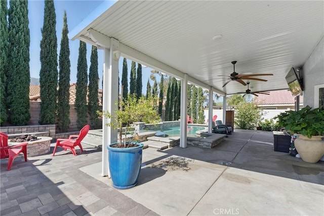 3140 Timberline Dr, Corona, CA 92882 - view of patio with a ceiling fan, a fire pit, and a fenced in pool