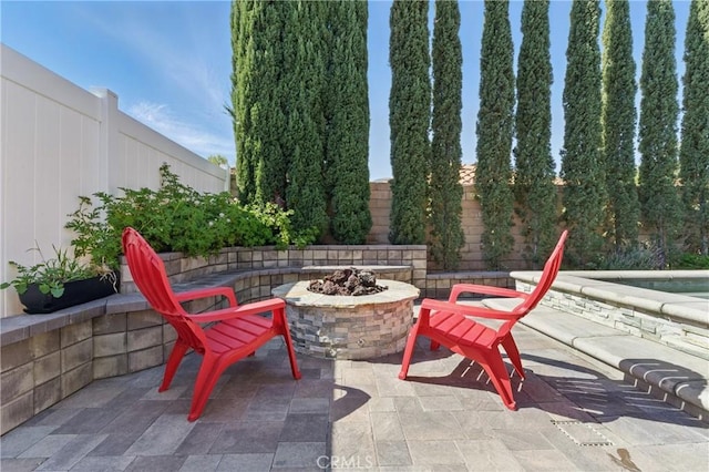 3140 Timberline Dr, Corona, CA 92882 - view of patio featuring a fire pit and a fenced backyard
