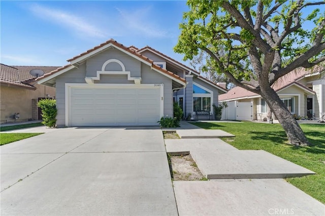 3140 Timberline Dr, Corona, CA 92882 - view of front of home with a tiled roof, a garage, a front yard, fence, and concrete driveway
