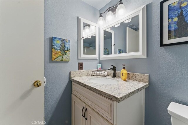 3140 Timberline Dr, Corona, CA 92882 - bathroom with toilet, vanity, and a textured wall