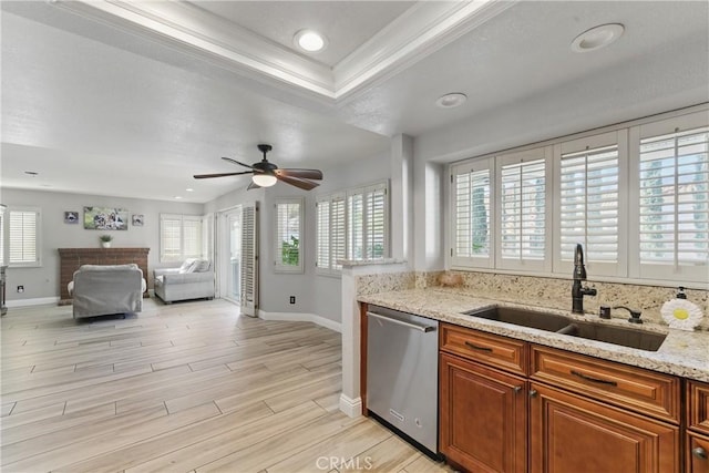 3140 Timberline Dr, Corona, CA 92882 - kitchen with brown cabinetry, light wood-style floors, dishwasher, and a sink