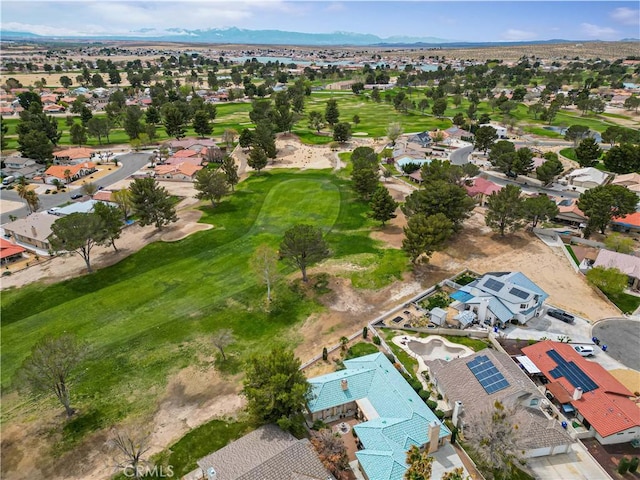 bird's eye view featuring a mountain view, golf course view, and a residential view