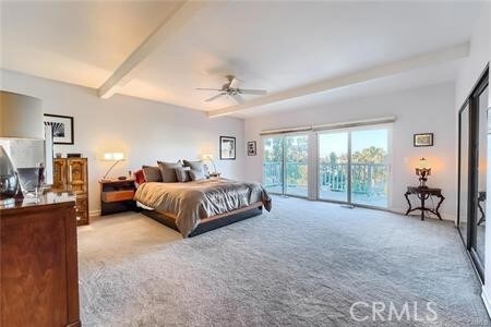 21651 Yucatan Ave, Woodland Hills, CA 91364 - bedroom with light carpet, access to outside, and ceiling fan