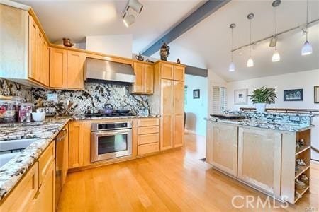 21651 Yucatan Ave, Woodland Hills, CA 91364 - kitchen with stainless steel oven, wall chimney range hood, rail lighting, black electric stovetop, and light wood-type flooring